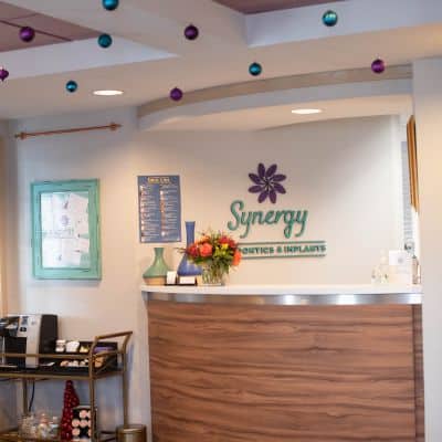 Synergy interior sign and receptionist area