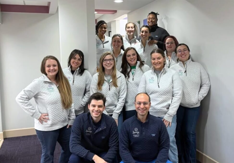 Synergy team smiling