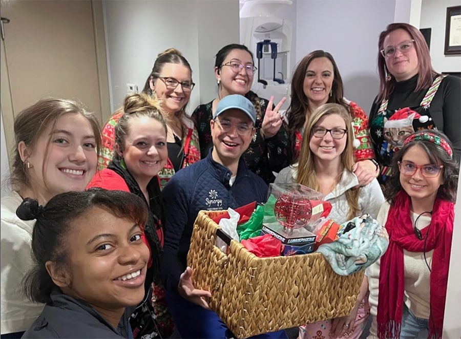 Team in tacky christmas sweaters