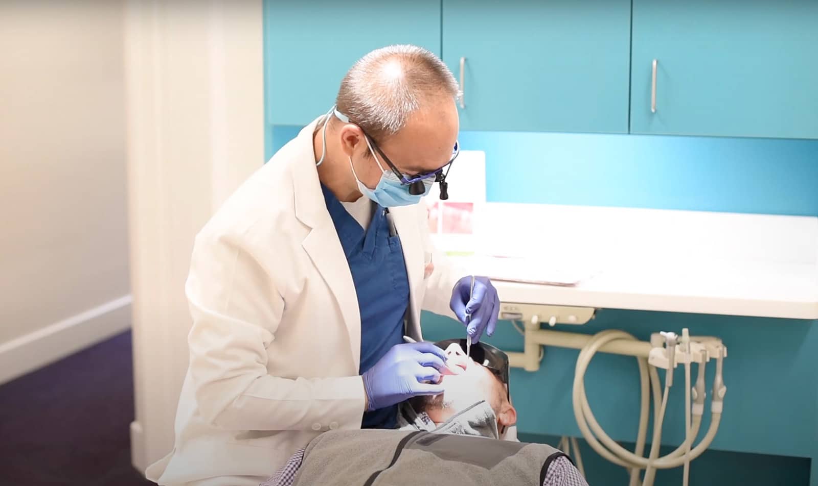 Dr dounis working on patient